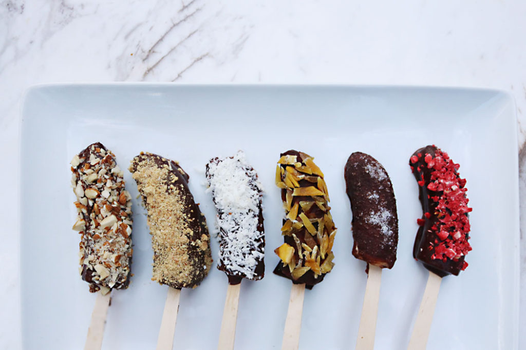 frozen-chocolate-banana-pops, raw cacao syrup, healthy chocolate banana pops, toppings, healthy toppings, coconuts, almonds, granola, salt and sweet