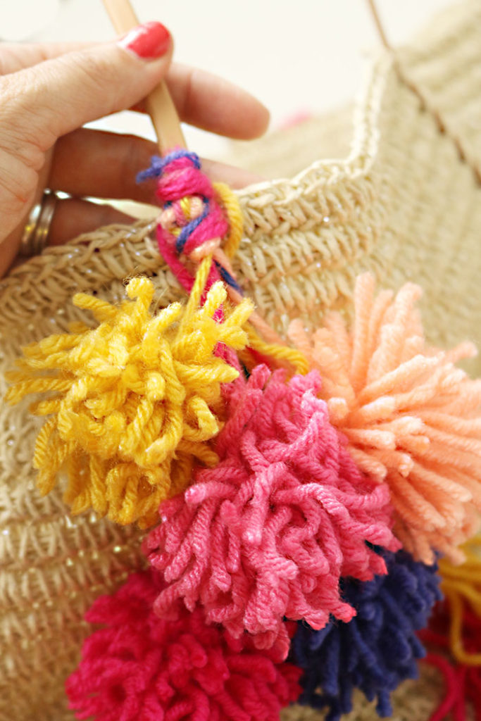 tie-pom-poms-to-bag