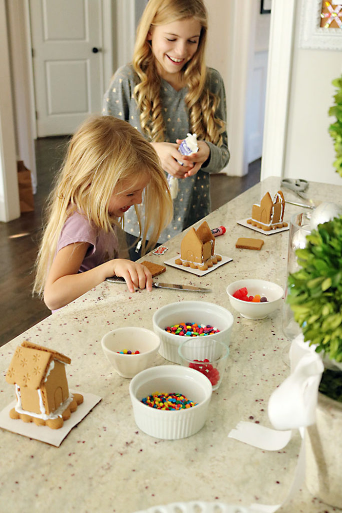 christmas-decorations-gingerbread-houses-laughing-girls