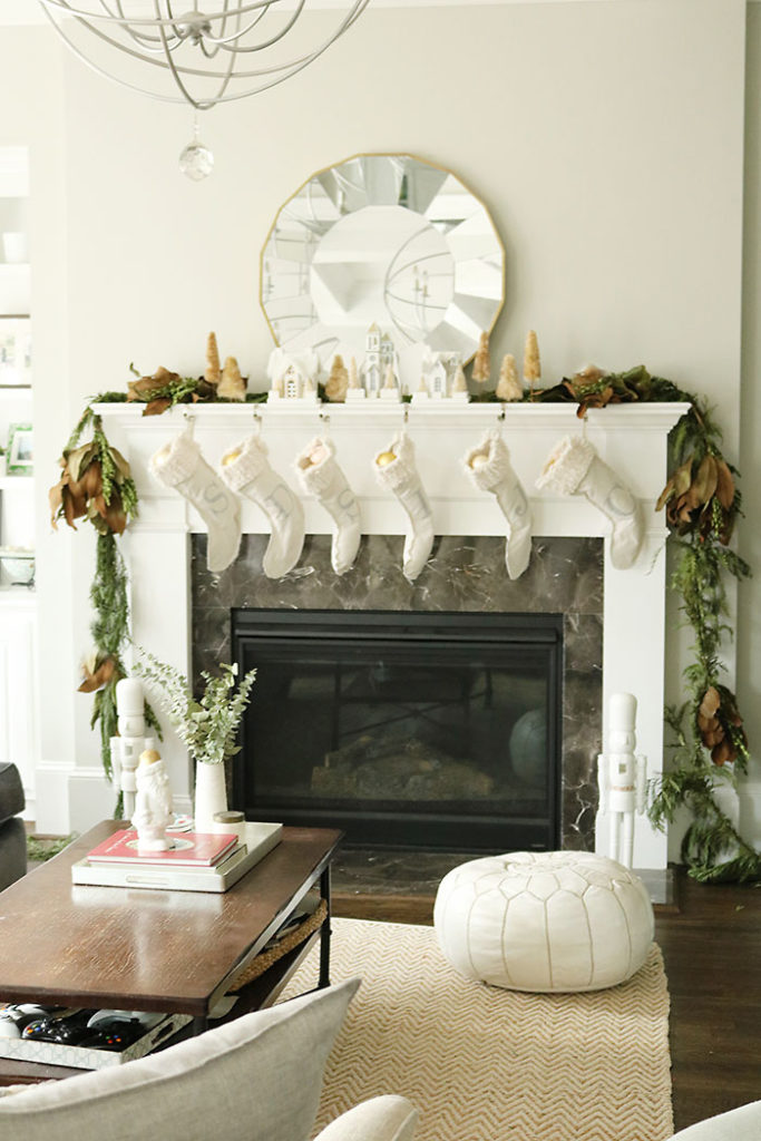 christmas-decorations-living-room-shot, fireplace mantle christmas decorations, magnolia garland, winter white christmas, living room christmas decorations