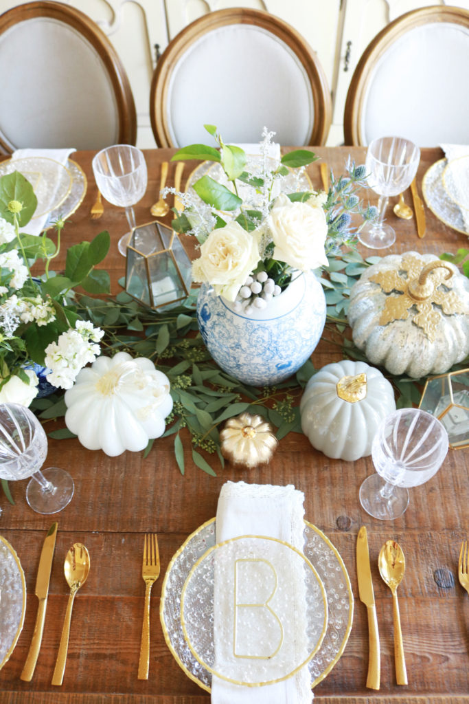 elegant thanksgiving table setting, chic thanksgiving table decorations, table setting pumpkins, thanksgiving flowers, thanksgiving geometric candle hurricane lanterns, gold table setting, thanksgiving tablescape, thanksgiving elegant rustic decorations, thanksgiving ideas, home goods table, pumpkin centerpieces, white pumpkin, thanksgiving dining room, beautiful thanksgiving, martha Stewart