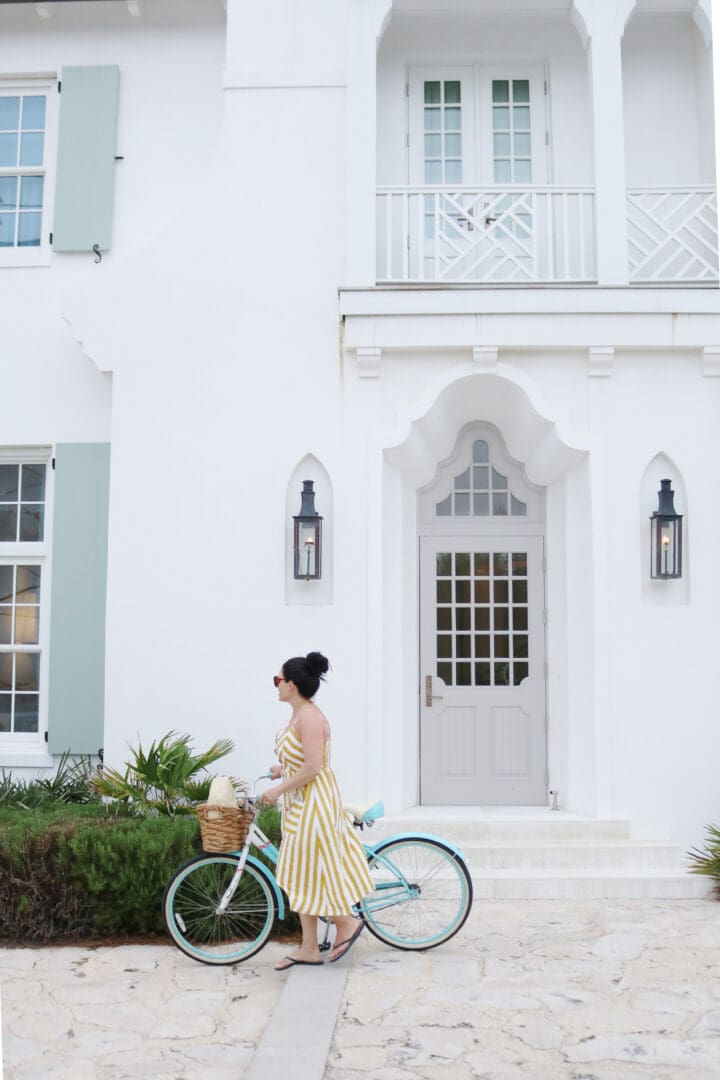 Biking around Alys Beach in my yellow striped button up dress, what beach vacation maxi dress to pack || Darling Darleen