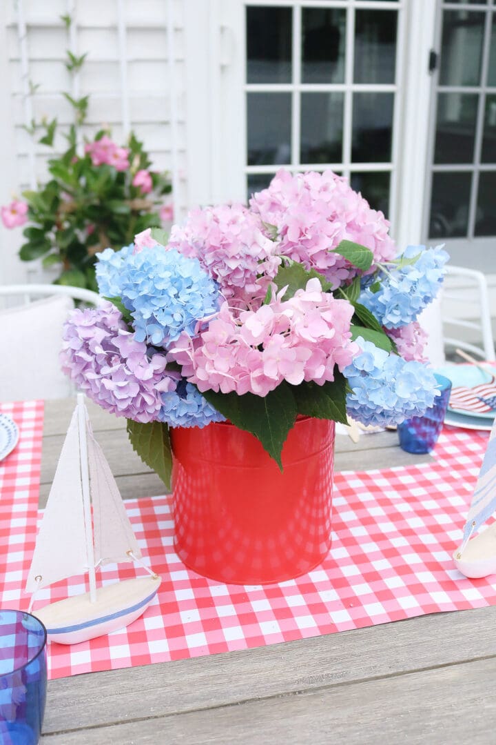 4th of july flower hydrangea arrangement.  This year host a 4th of July barbecue party and sharing simple budget-friendly decorating tips, 4th of July outfit, red gingham dress, 4th of July entertaining tips, american flag decorations, backyard party, 4th of july tablescape  || Darling Darleen Top CT Lifestyle Blogger #4thofjuly #4thofjulyoutfit