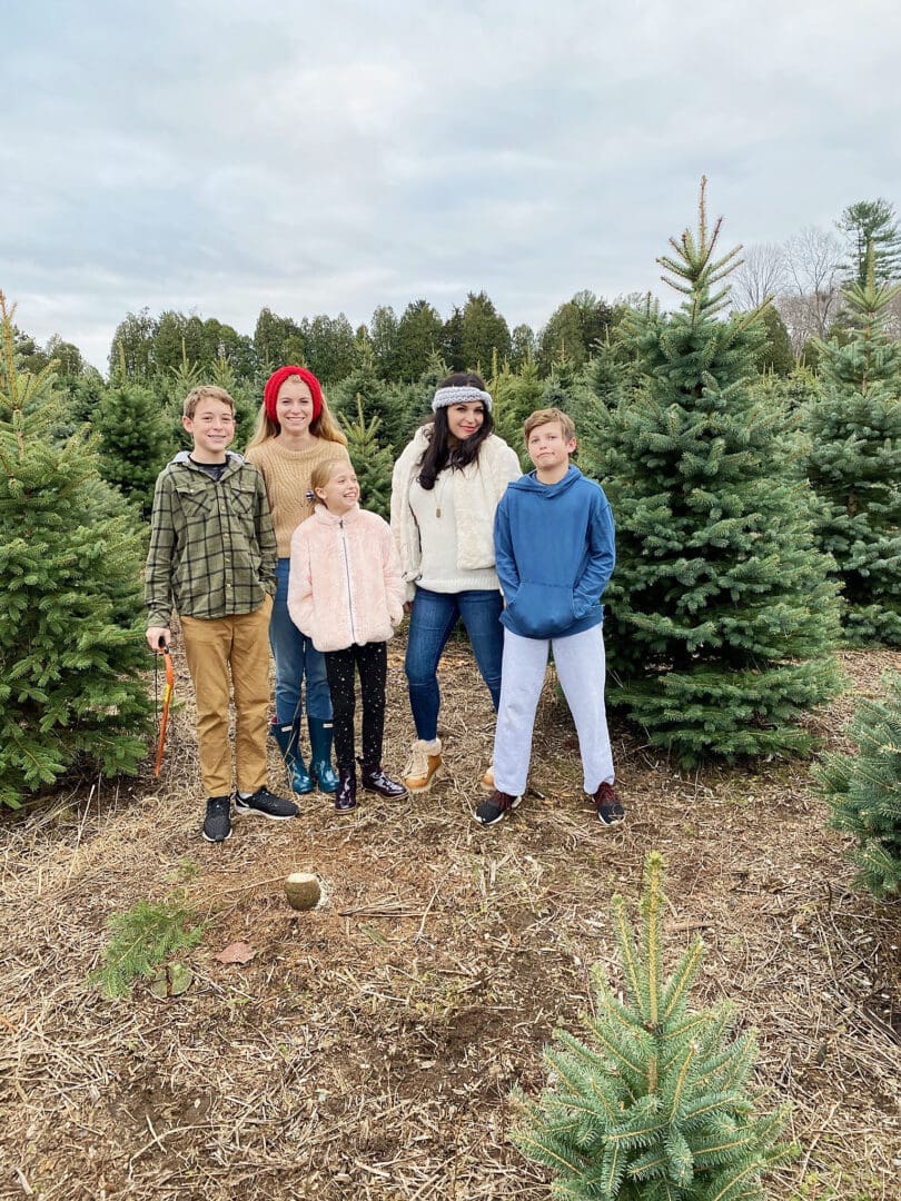 Our annual family tradition brings us to the Christmas Tree farm to find the perfect Christmas tree to cut down and bring home to decorate! Cutting down Christmas Tree.  Christmas tree cutting outfits || Darling Darleen Top Lifestyle Blogger 