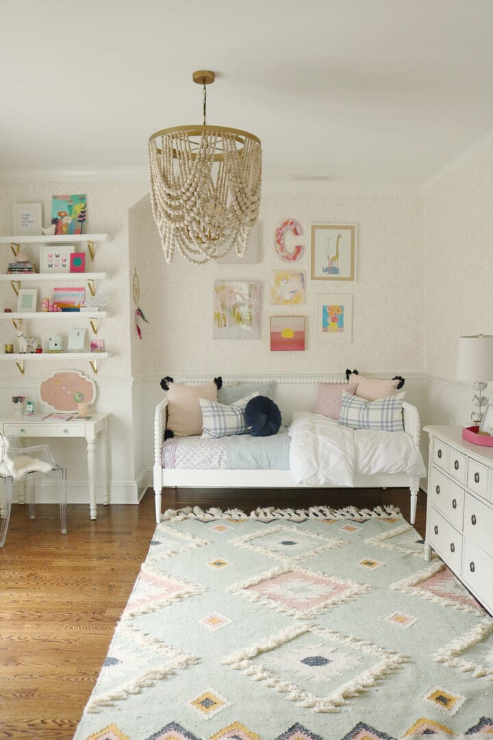 Light Blue Pink Girls Bedroom that mixes textures and art pieces.  It's playful and charming girl's bedroom.  Before and after bedroom, pastel colors girl bedroom, tween girl bedroom, Serena and lily priano wallpaper, reading corner, anthropologie chair || Darling Darleen Top CT Lifestyle Blogger #girlsbedroom