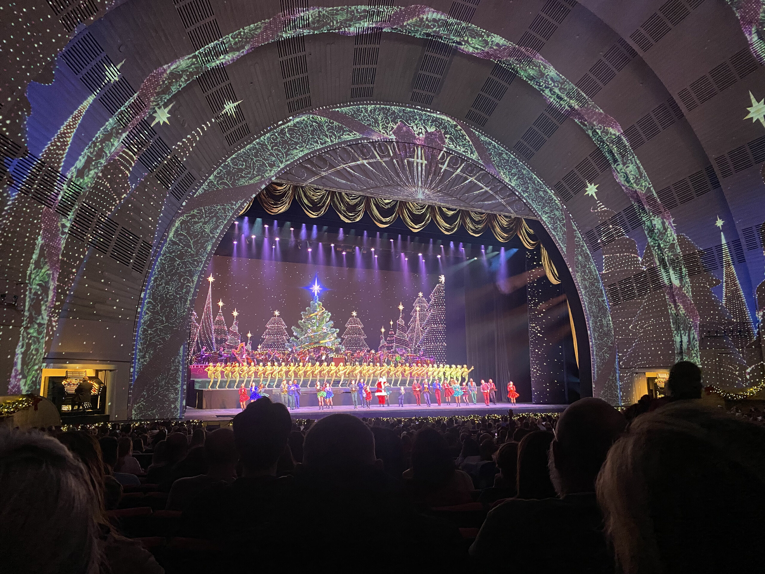 Christmas in New York City Rockettes--Our Favorite Things to Do in New York City that will make your trip memorable, festive and of course magical! Red wreaths on doors and windows Darling Darleen Top Lifestyle blogger