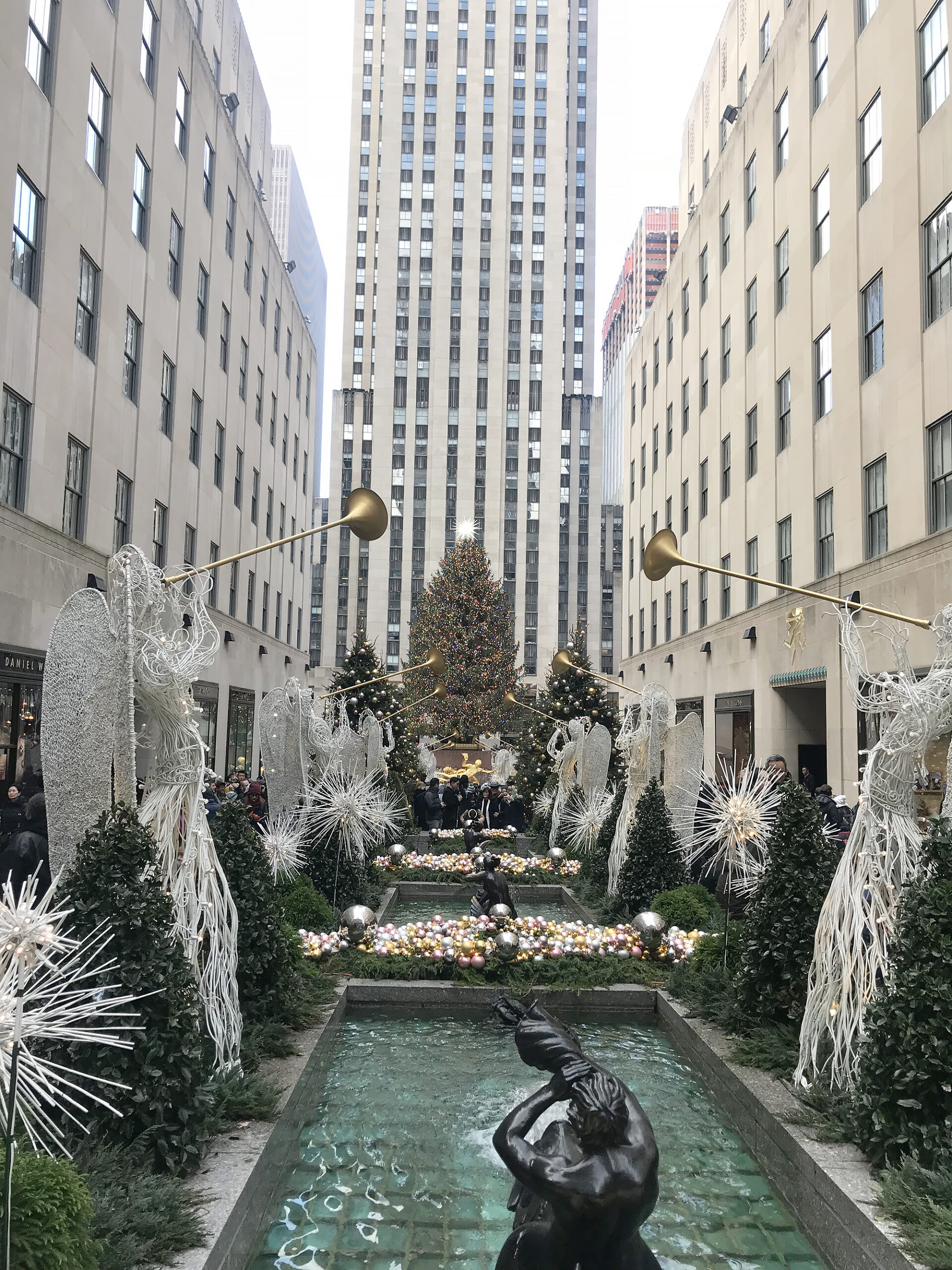 Christmas in New York City--Our Favorite Things to Do in New York City that will make your trip memorable, festive and of course magical! Rockefeller Plaza Darling Darleen Top Lifestyle blogger