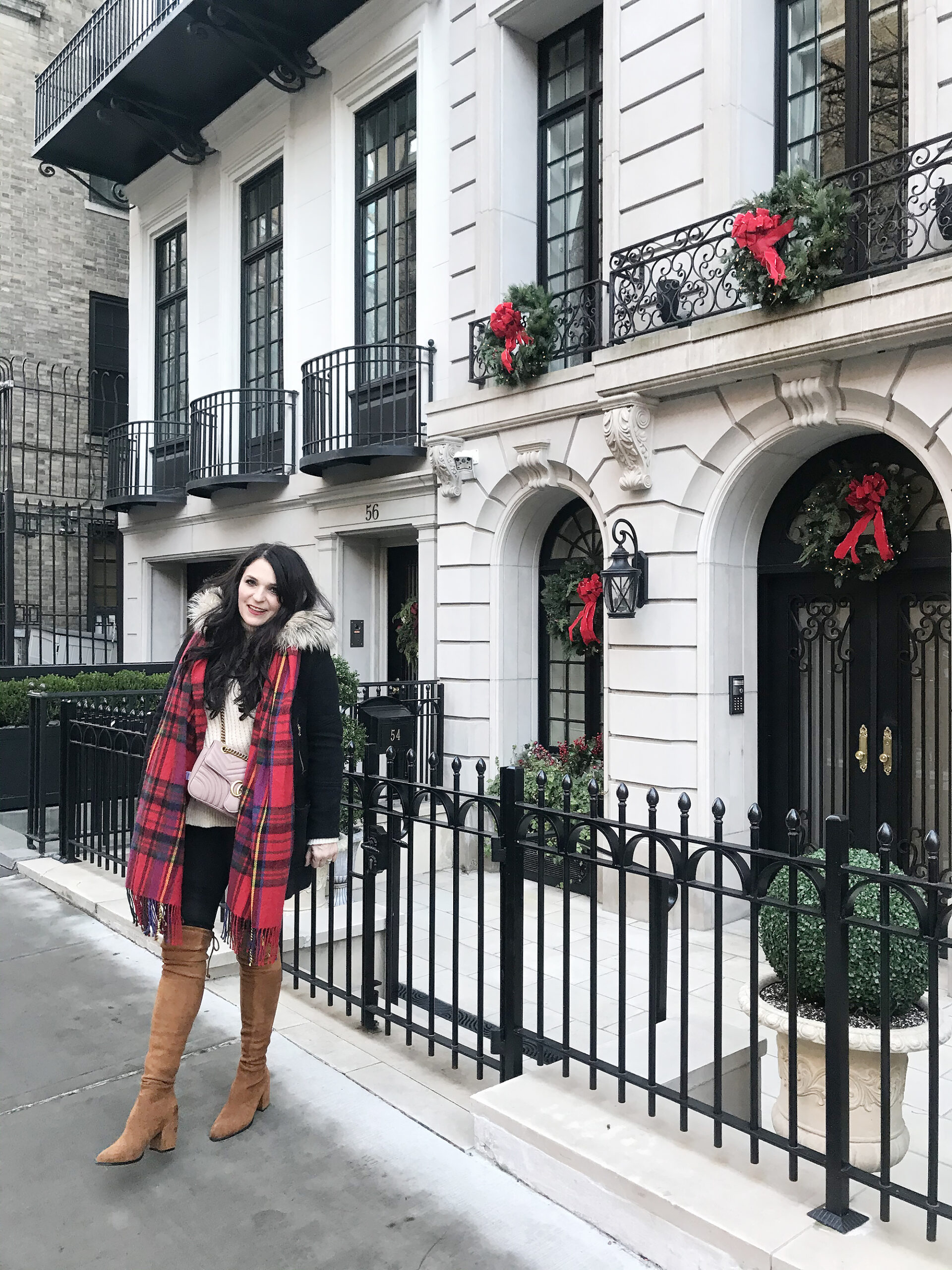 Christmas in New York City--Our Favorite Things to Do in New York City that will make your trip memorable, festive and of course magical! Red wreaths on doors and windows Darling Darleen Top Lifestyle blogger